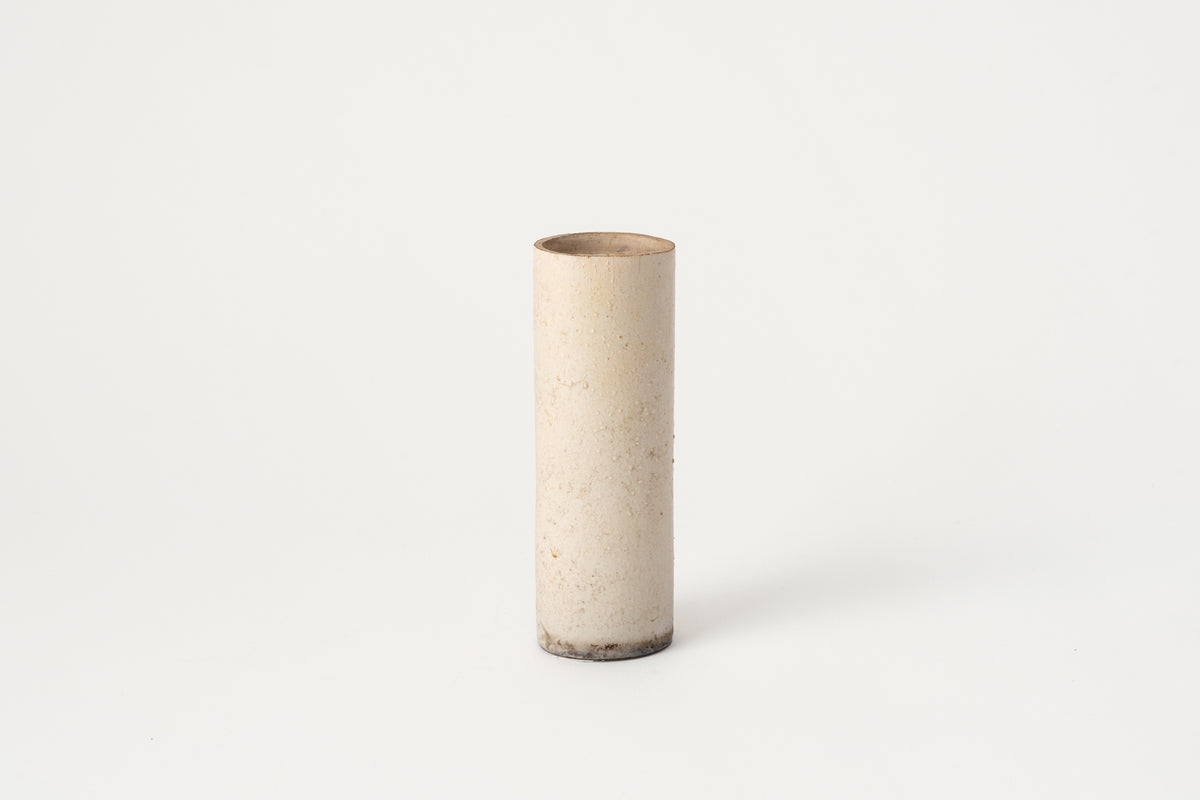 Cylindrical ceramic vase on a white background