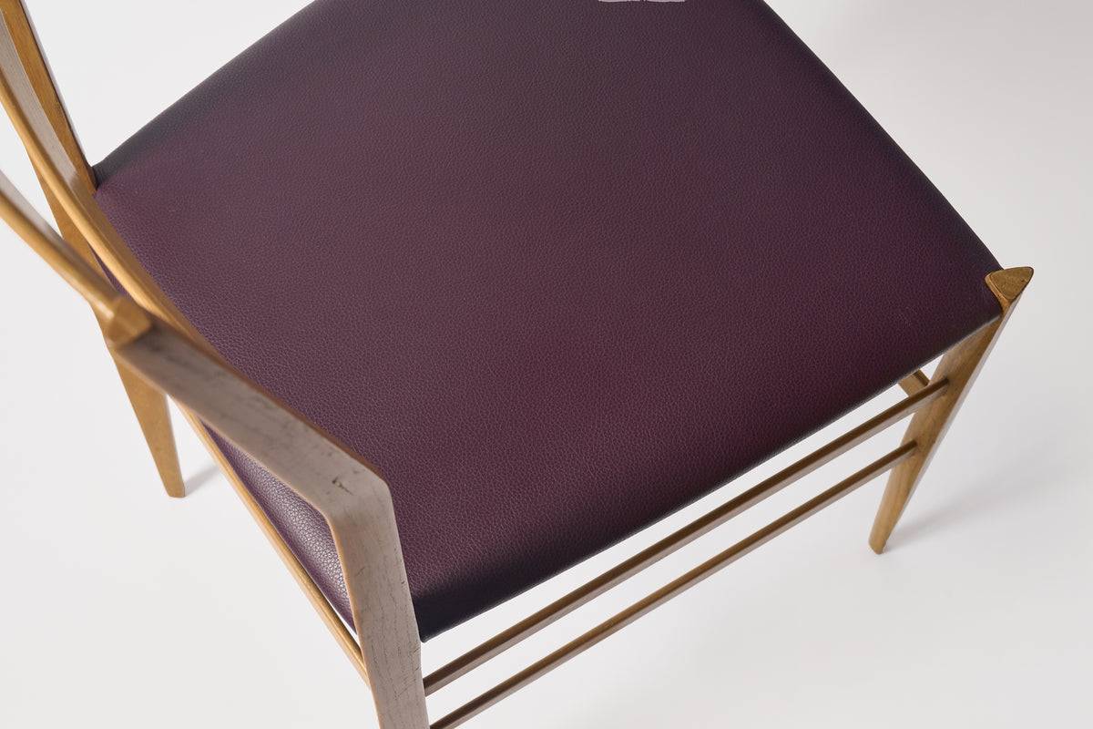 Chair with a purple cushion on a white background
