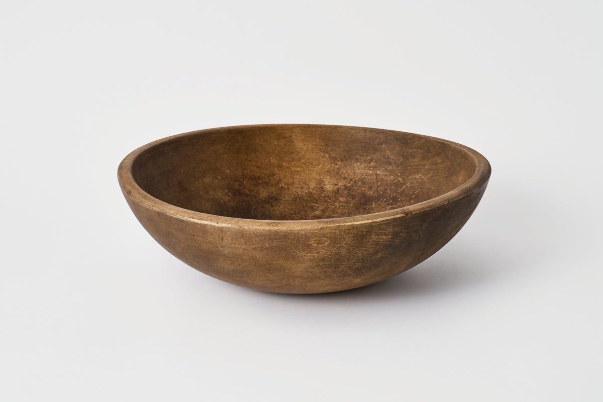 Wooden bowl on a white background